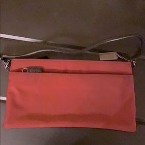 Genuine Coach handbag. Red fabric with black.